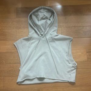 Cream colored sleeveless cropped hoodie